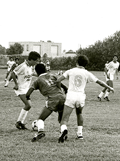 Photograph of FAU men's soccer team players during a game
