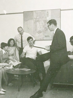 Photograph of early Student Government representatives talking in a meeting