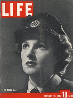 Photograph of a World War II era woman wearing a military style cap, staring at the LIFE Magazine Logo