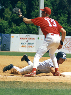 Photograph of FAU men's baseball players during a game